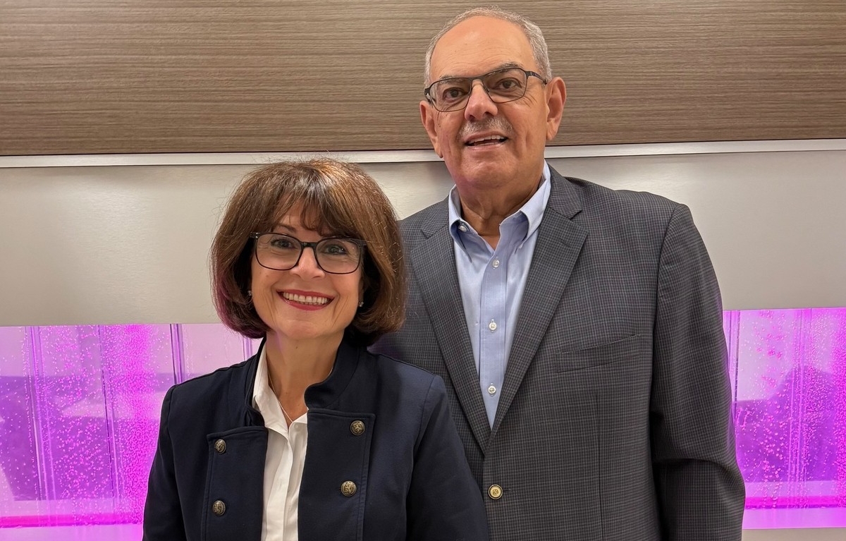 Laïla Ward Farag and Hani Farag Laïla Ward Farag and Hani Farag are both wearing glasses and blazers and are smiling.